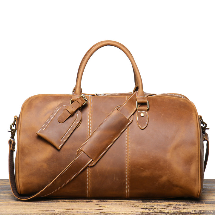 Herren-Reisetasche aus echtem Leder – Strukturierte Silhouette und abnehmbare Schulterriemen