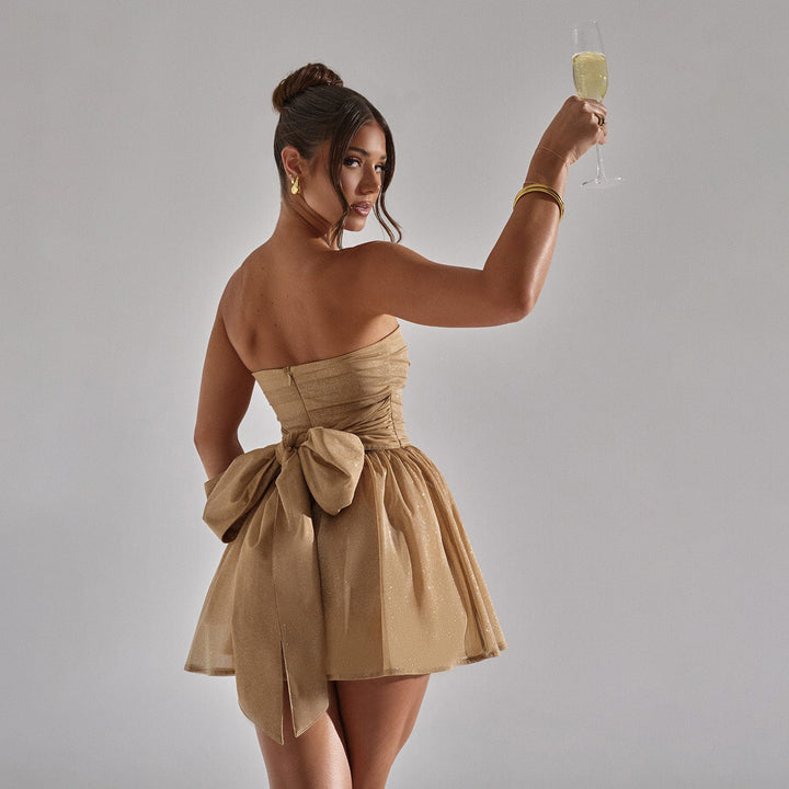 Abito da donna con bustier in pizzo – gonna corta in tulle con fiocco sul retro