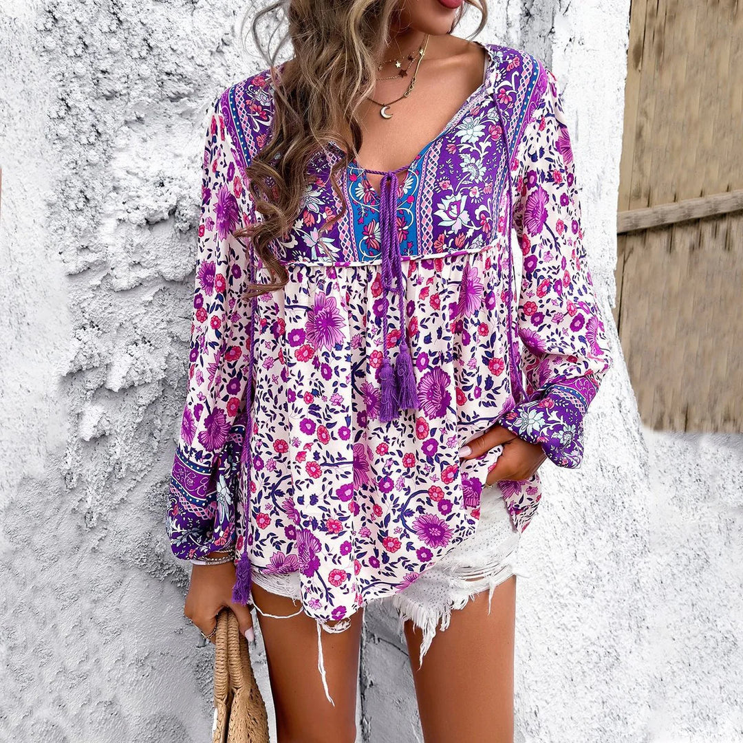 Blusa donna con stampa floreale – scollo a V e maniche a sbuffo