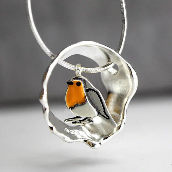 Ketting Dames met opengewerkte vogelhangertje – retro geometrisch patroon