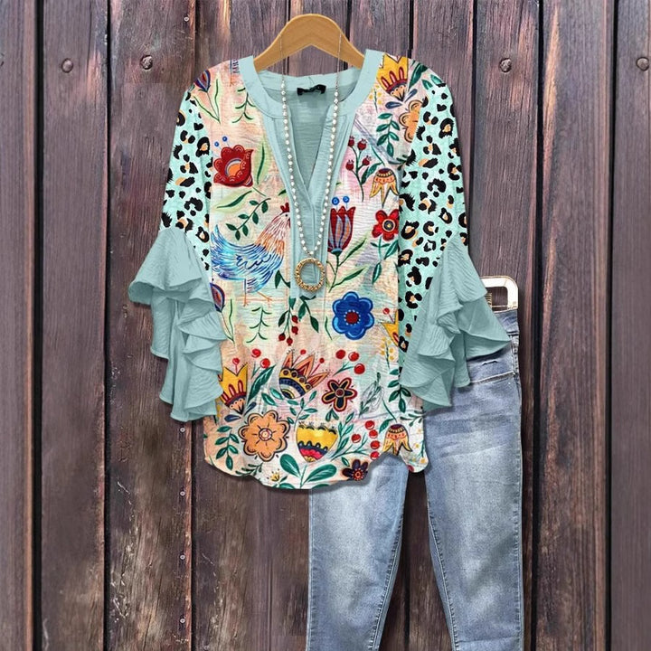 Blusa donna con stampa botanica – maniche a volant e scollo a V
